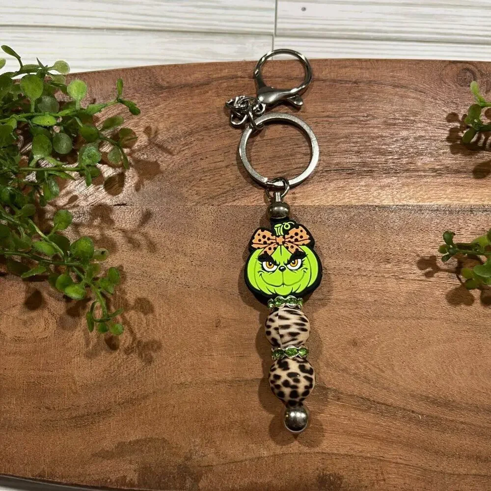 Grinch Bar Keychains in Festive Tree and Leopard Beads for Holiday Gifts - Picture 3 of 3